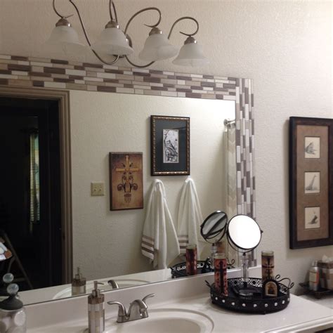 Stick-on tile border for bath mirror. | Diy mirror frame bathroom, Bathroom mirror frame ...