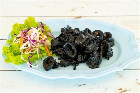 fried squid with squid ink sauce 6572221 Stock Photo at Vecteezy