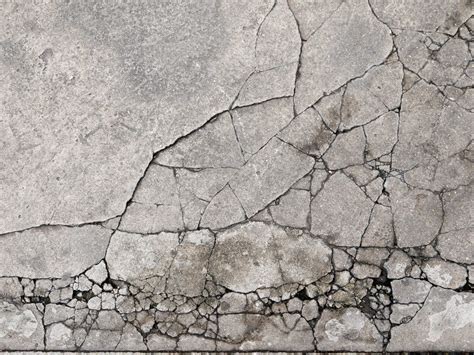 Cracked concrete texture closeup background - CI Pavement