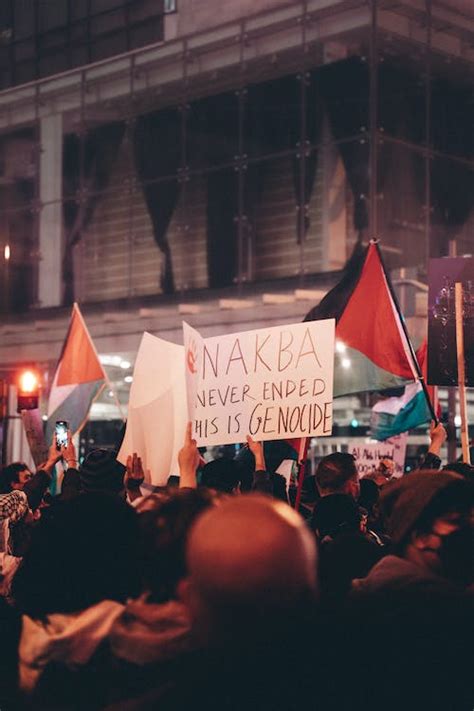 Crowd of Protesters with Palestinian Flags and Protest Signs at Night ...