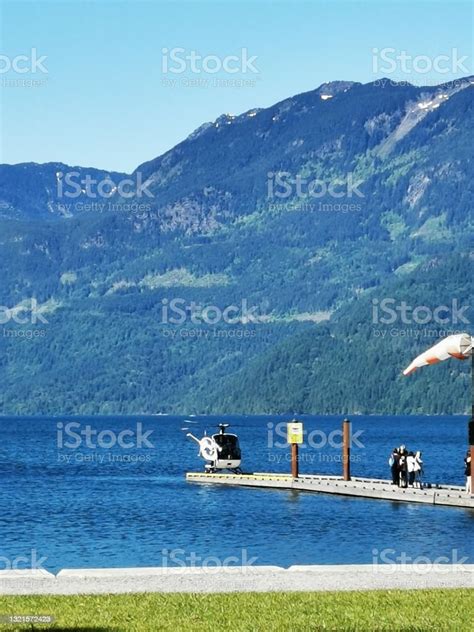 Helicopter Landing On Lakeshore Dock Stock Photo - Download Image Now ...