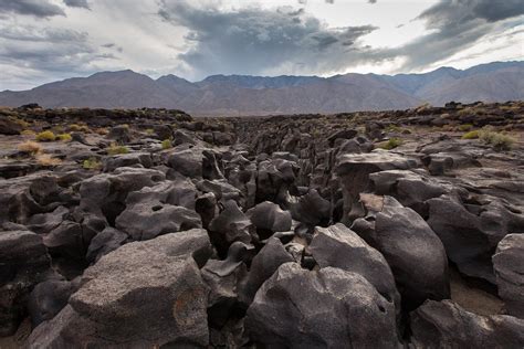 Fossil Falls is a dry waterfall containing smoothed basaltic stone formations in California's ...