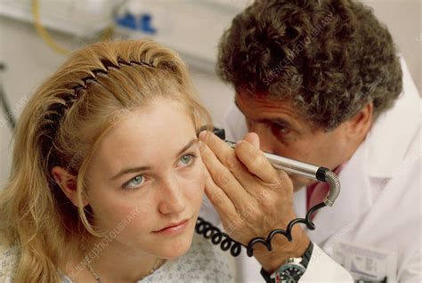 Ear examination - Stock Image - M540/0358 - Science Photo Library