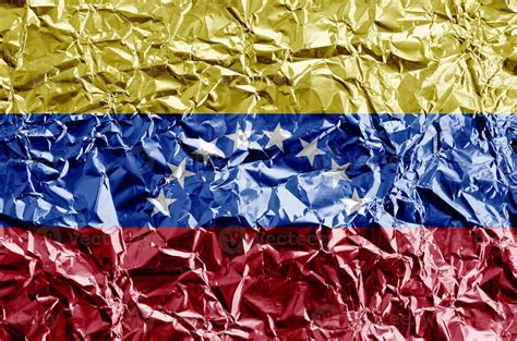 Venezuela flag depicted in paint colors on shiny crumpled aluminium ...