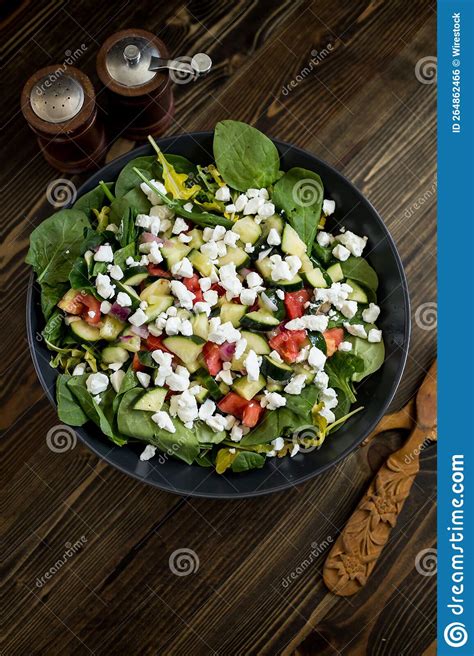 Vertical Top View of Good-looking Salad with a Wooden Spoon and Fork ...