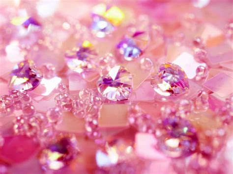 Download A dazzling pink diamond glistening against a light grey ...