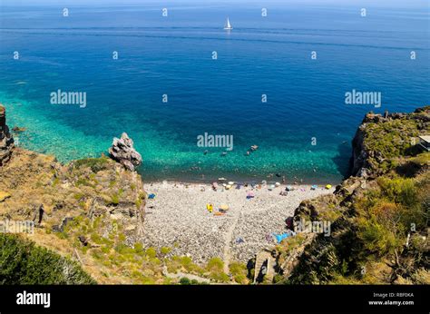 Aerial view of the crystal clear sea water at Spiaggia dello Scario beach in Malfa, Salina ...