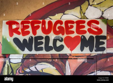 refugees welcome graffiti sign Stock Photo - Alamy