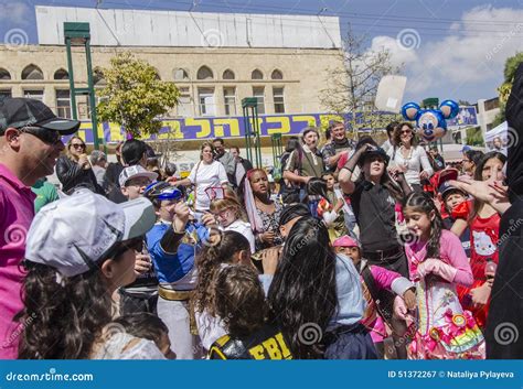 Beer-Sheva, ISRAEL - March 5, 2015: Children in Carnival Costumes Catch the Gifts on the Feast ...