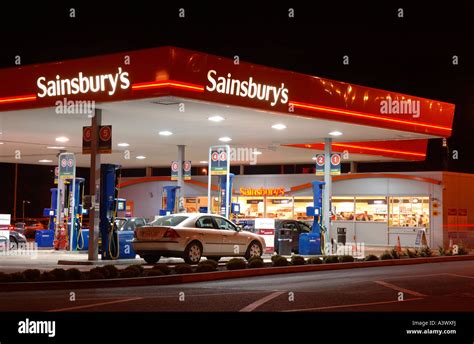 Sainsburys petrol station at night Stock Photo - Alamy