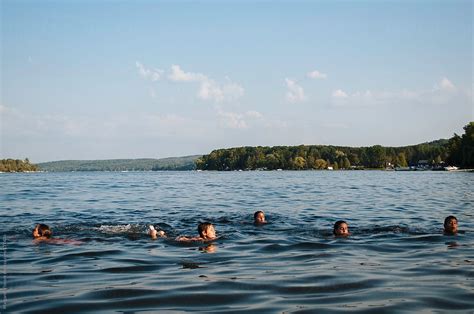 "A Group Of Children Swimming In A Lake" by Stocksy Contributor ...