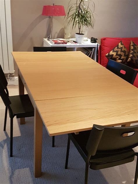 Ikea Bjursta Extendable Dining Table and 4 Herman Chairs | in Woking, Surrey | Gumtree