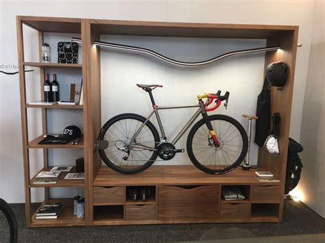 a bike is mounted on a wooden shelf