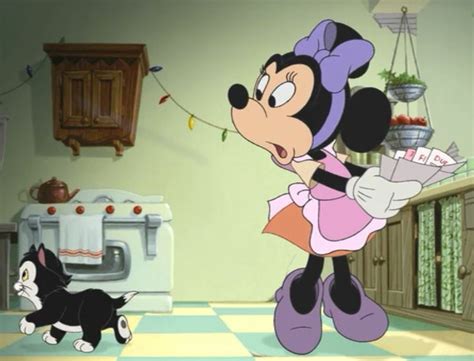 minnie and her kitten are in the kitchen