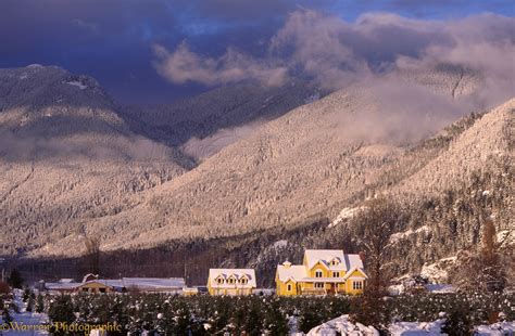 Yellow house in snow scene photo WP01916