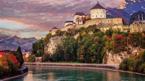 Kufstein Old Town with medieval fortress on a rock over the Inn river at sunset, Austria ...