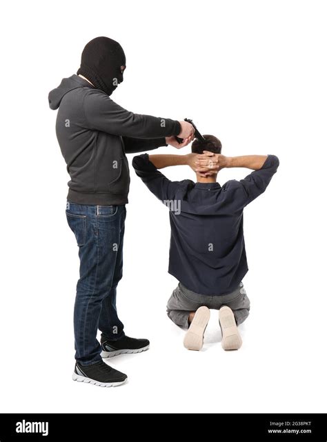 Terrorist aiming at hostage on white background Stock Photo - Alamy