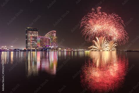 Celebration of UAE National Day with fireworks over the Festival City district. Dubai, UAE ...