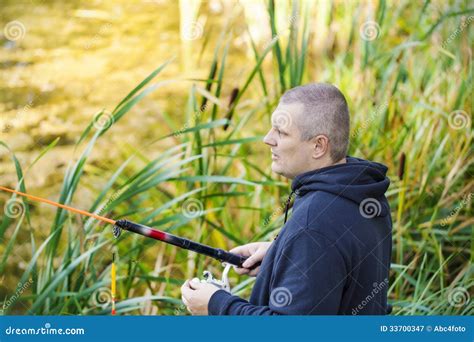 Man fishing near lake stock image. Image of glory, fishing - 33700347