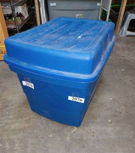 Pet toys and supplies in plastic storage tote - Mark Van Hook, Auctioneer