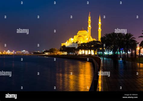 Al Noor mosque in Sharjah reflected in the lake at night Stock Photo ...