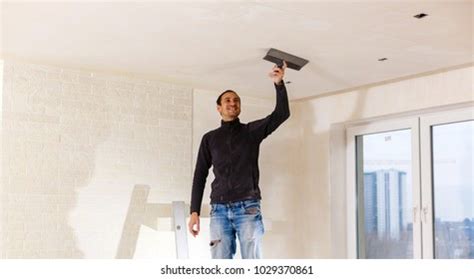 Young Man Repairing Hole Wall Stock Photo 1029370861 | Shutterstock