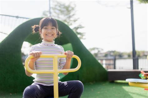 Kids playing at the see-saw in the playground 11576685 Stock Photo at ...