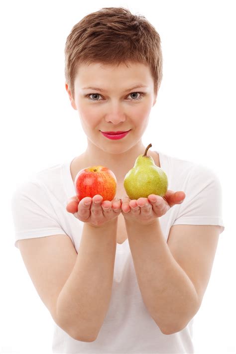Healthy Woman Holding Fresh Apple and Pear