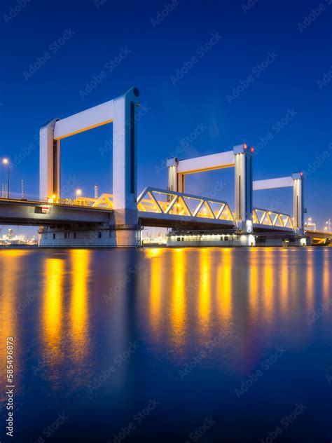 Botlek bridge, Rotterdam, Netherlands. View of the bridge at night. Road for cars and railroad ...