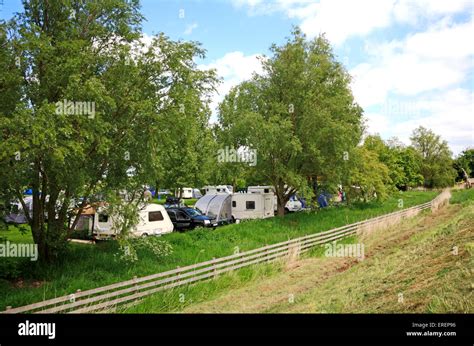 A view of a small camping site on the Norfolk Broads by Reedham Ferry, Norfolk, England, United ...