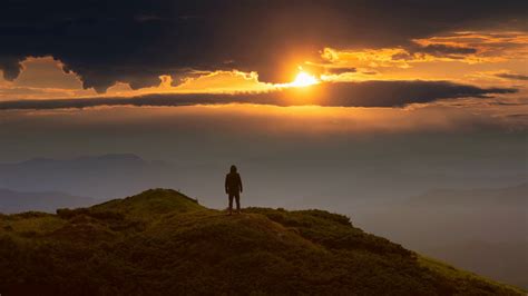 The man standing on a mountain top against the bright sunrise. time lapse Stock Video Footage ...