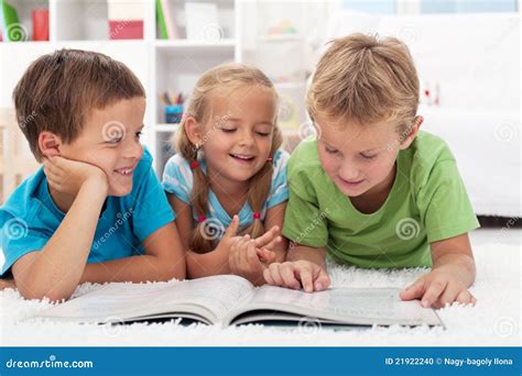 Kids having fun reading stock photo. Image of person - 21922240