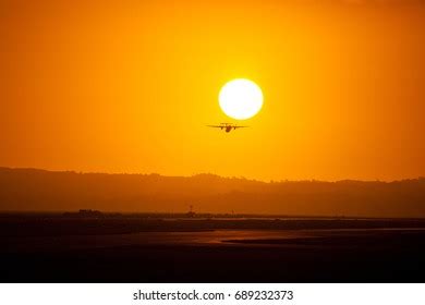 Airplane Taking Off Into Sunset Stock Photo 689232373 | Shutterstock