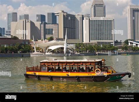 sightseeing boat on the Singapore River, the skyline of Singapore ...