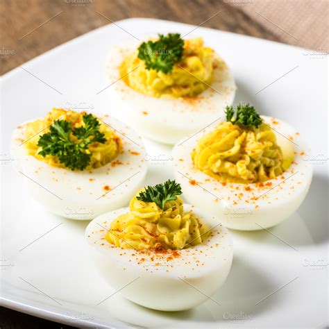 Deviled eggs on white plate ~ Food & Drink Photos ~ Creative Market