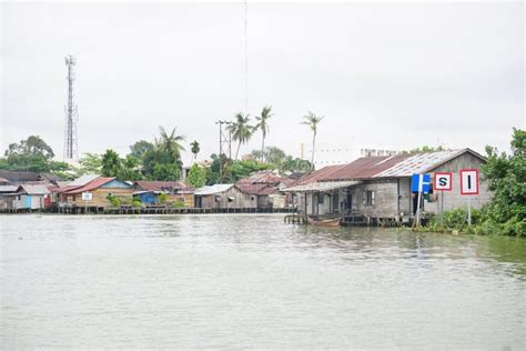 Martapura River with Houses and Signs on the Riverbank Editorial Stock Image - Image of landmark ...