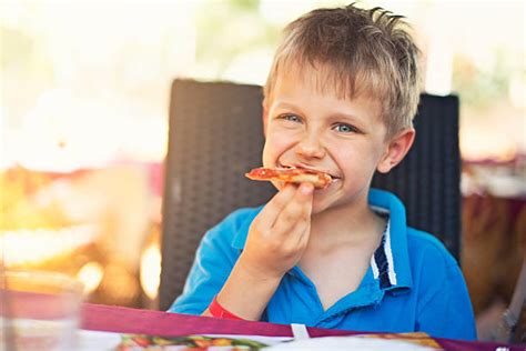 Kids Eating Pizza Pictures, Images and Stock Photos - iStock