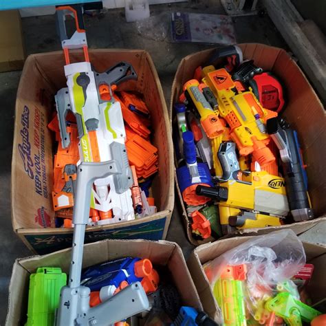 4 BOXES OF NERF GUNS AND PARTS