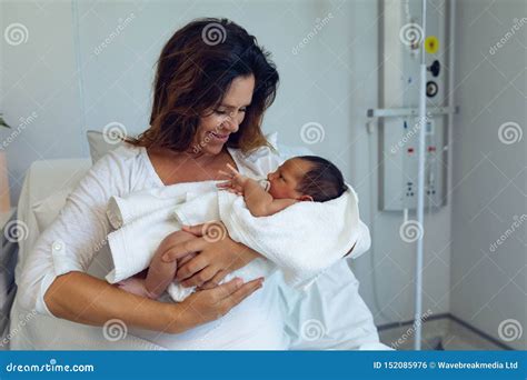 Mother Holding Her Newborn Baby Child after Labor in the Ward Stock ...