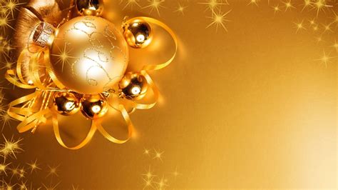 Lights reflecting in the golden Christmas decorations wallpaper ...