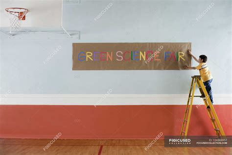 Green Science Fair sign on a wall. — daylight, daytime - Stock Photo ...