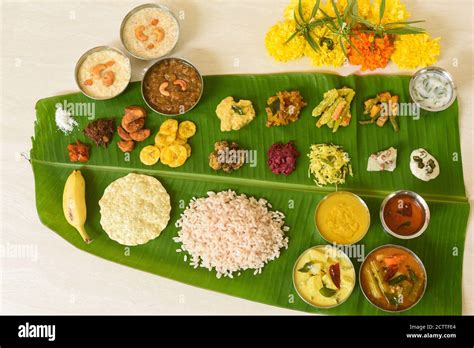 Onam sadhya, Indian women eating with hand boiled rice, served for ...