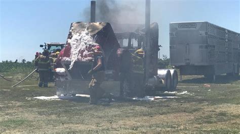 The semi-truck caught fire in a field on 73rd street in Agency, Iowa Sunday afternoon./KTVO{p ...