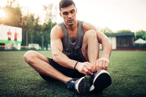 Man Prepares for Outdoor Fitness Workout Stock Image - Image of athletic, power: 121427007