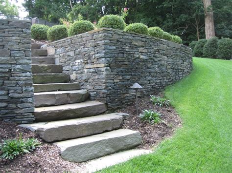 A natural stone retaining wall and steps | Island Hardscapes Ltd., Long ...