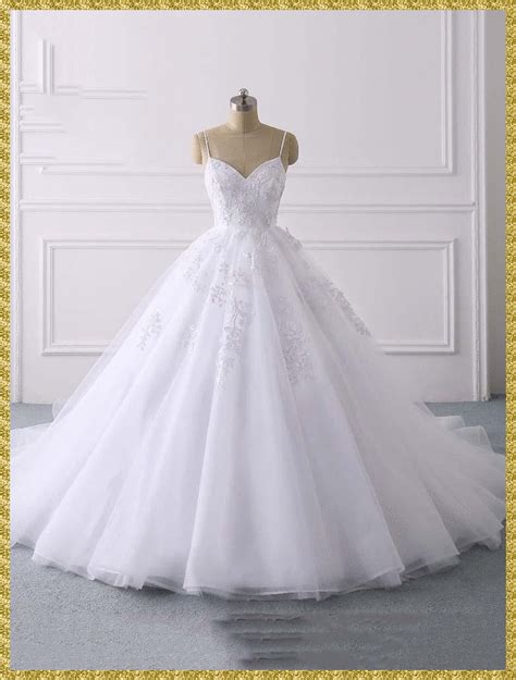 a white wedding dress on a mannequin