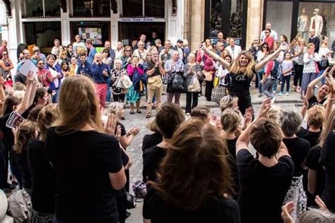 Watch as singing flash mob belts out ‘You’ll Never Walk Alone’ in Guildford - Surrey Live