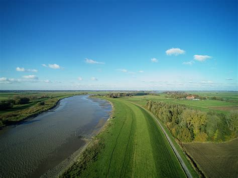Free Images : landscape, coast, road, windmill, river, reflection, terrain, aerial view, plain ...