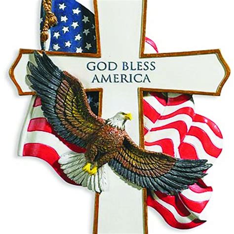 an american flag and eagle cross with god bless america written on the cross in gold