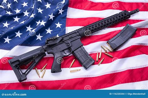 Custom Built AR-15 Carbine, Bullets and a Magazine on American Flag Surface, Background. Studio ...